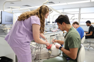 Dental students in simulation lab D611.