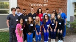 Student group outside, in front of college of dentistry