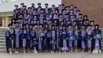 DMD Class of 2025 in cap and gown.