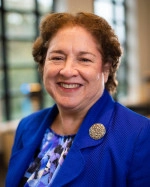 Linda Epling in blue jacket and blouse.